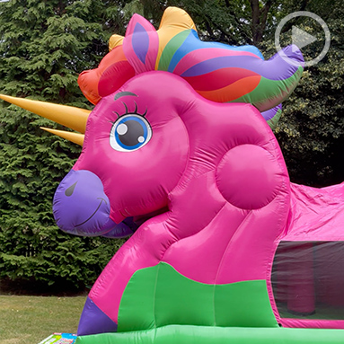 Garden party at Debden House, outdoors on a sunny day, with an inflatable unicorn