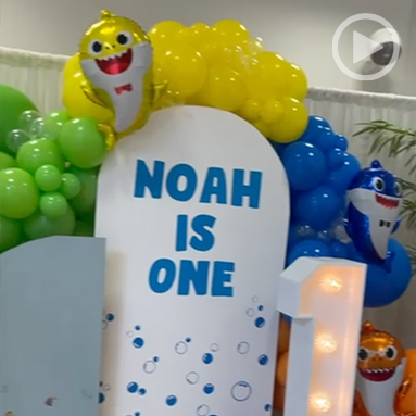 First birthday party at Debden House with balloons, presents, and decorations