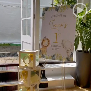 First birthday party at Debden House with decorations, table setting, and television
